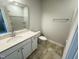 Bathroom with tiled floors, sink with quartz countertops, shaker cabinets and shower-tub combo at 115 Central Townes Way # 300, Raleigh, NC 27603