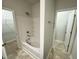 Full bathroom features shower-tub combo with tiled enclosure and a linen closet to the left at 115 Central Townes Way # 300, Raleigh, NC 27603