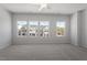 Spacious bedroom featuring a ceiling fan and three windows offering lots of natural light at 115 Central Townes Way # 300, Raleigh, NC 27603