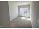 Comfortable bedroom featuring a window providing natural light with plush carpet at 115 Central Townes Way # 300, Raleigh, NC 27603