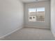 Bedroom featuring a double window offering lots of natural light at 115 Central Townes Way # 300, Raleigh, NC 27603