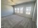 Spacious bedroom with three large windows and neutral carpeting that brightens up the space at 115 Central Townes Way # 300, Raleigh, NC 27603