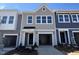 Charming townhome with a one-car garage and traditional architectural design at 115 Central Townes Way # 300, Raleigh, NC 27603