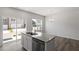 Kitchen island with granite countertops, stainless steel dishwasher, and plenty of storage at 115 Central Townes Way # 300, Raleigh, NC 27603