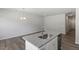 Modern kitchen island with granite countertops, stainless steel dishwasher, and pendant lighting at 115 Central Townes Way # 300, Raleigh, NC 27603