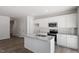 Modern kitchen with stainless steel appliances, granite countertops, and an island sink at 115 Central Townes Way # 300, Raleigh, NC 27603
