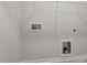 A laundry room with hookups and wire rack shelving at 115 Central Townes Way # 300, Raleigh, NC 27603