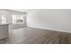 Hardwood floors throughout the living space with a view of the backyard at 115 Central Townes Way # 300, Raleigh, NC 27603