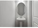 Half bathroom featuring a pedestal sink and an oval mirror at 115 Central Townes Way # 300, Raleigh, NC 27603