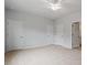 Spacious bedroom features neutral carpet, ceiling fan, and an ensuite bathroom at 116 Fideaux Blvd # 258, Raleigh, NC 27603