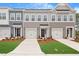 Attractive townhomes with a pleasing color scheme, well-kept landscaping, and individual garages for each unit at 116 Fideaux Blvd # 258, Raleigh, NC 27603