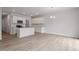 Modern kitchen features white cabinets, an island, granite counters and stainless steel appliances at 116 Fideaux Blvd # 258, Raleigh, NC 27603