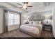 Relaxing main bedroom with a tray ceiling, a large window and a plush king-sized bed at 116 Fideaux Blvd # 258, Raleigh, NC 27603