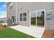 A concrete patio with gray siding and a sliding glass door offers outdoor space at 116 Fideaux Blvd # 258, Raleigh, NC 27603