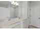 Bright bathroom with double sink vanity, framed mirror and tiled floors at 119 Central Townes Way # 301, Raleigh, NC 27603