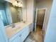 Bathroom featuring double vanity, large mirror, bathtub, shower and tile floors at 119 Central Townes Way # 301, Raleigh, NC 27603
