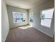Bright bedroom with neutral carpet, multiple windows, and ample natural light at 119 Central Townes Way # 301, Raleigh, NC 27603