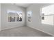 Bright bedroom boasting large windows that provide neighborhood views and plenty of sunlight at 119 Central Townes Way # 301, Raleigh, NC 27603