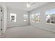 Large bedroom with carpet floors and natural light from multiple windows at 119 Central Townes Way # 301, Raleigh, NC 27603