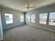 Spacious bedroom with neutral carpet, multiple windows, and ample natural light at 119 Central Townes Way # 301, Raleigh, NC 27603