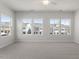 Bright bedroom with ample natural light from the multiple large windows at 119 Central Townes Way # 301, Raleigh, NC 27603