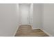 Bright entryway featuring wood-look flooring, white walls, and closet at 119 Central Townes Way # 301, Raleigh, NC 27603