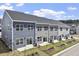 Townhome exterior features multiple windows for natural light at 119 Central Townes Way # 301, Raleigh, NC 27603