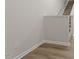 Clean wall showing floor trim, outlet, and staircase at 119 Central Townes Way # 301, Raleigh, NC 27603