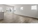 Bright living room with wood floors, recessed lighting, and natural light from multiple windows at 119 Central Townes Way # 301, Raleigh, NC 27603