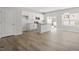 Open floor plan featuring a modern kitchen, dining area and living space with wood floors at 119 Central Townes Way # 301, Raleigh, NC 27603