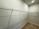 Large walk-in closet featuring wire shelving and neutral walls at 119 Central Townes Way # 301, Raleigh, NC 27603