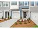 Well-maintained townhome with garage, landscaped yard and contemporary exterior lighting at 120 Fideaux Blvd # 257, Raleigh, NC 27603