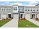 Charming townhomes featuring modern design, individual garages, and beautifully landscaped front yards at 120 Fideaux Blvd # 257, Raleigh, NC 27603