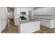 Open kitchen featuring granite countertops, an island, and stainless steel appliances at 120 Fideaux Blvd # 257, Raleigh, NC 27603