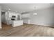 Spacious, open-concept living and kitchen area with hardwood floors and plenty of natural light at 120 Fideaux Blvd # 257, Raleigh, NC 27603