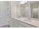 Bright bathroom with double sink vanity, quartz countertop and large mirror at 124 Fideaux Blvd # 256, Raleigh, NC 27603