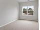 Bedroom featuring a large window providing ample natural light at 124 Fideaux Blvd # 256, Raleigh, NC 27603