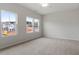 Spacious bedroom featuring large windows, neutral carpet, and a ceiling fan at 124 Fideaux Blvd # 256, Raleigh, NC 27603