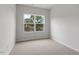 Bedroom featuring a large window providing ample natural light at 124 Fideaux Blvd # 256, Raleigh, NC 27603
