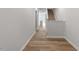 The entryway showcases the elegant staircase and leads to a welcoming interior space with wood floors at 124 Fideaux Blvd # 256, Raleigh, NC 27603