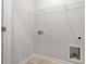 Convenient laundry room with hookups and shelving at 124 Fideaux Blvd # 256, Raleigh, NC 27603