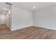 The open living area is filled with natural light and showcases beautiful wood floors at 124 Fideaux Blvd # 256, Raleigh, NC 27603