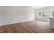 A bright living room featuring beautiful flooring and large windows at 124 Fideaux Blvd # 256, Raleigh, NC 27603