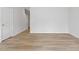 Empty room featuring hardwood flooring and fresh, neutral paint at 128 Fideaux Blvd # 255, Raleigh, NC 27603