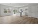 Open-concept kitchen with white cabinets, an island, and stainless steel appliances at 128 Fideaux Blvd # 255, Raleigh, NC 27603