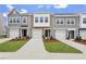 A row of newly built townhomes feature individual garages and well-maintained front yards at 128 Fideaux Blvd # 255, Raleigh, NC 27603