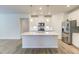 Kitchen island with white quartz countertop at 13 Parker Pond Ct, Durham, NC 27703