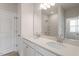 Bathroom featuring dual sinks, a large mirror, and ample counter space and bright light at 132 Fideaux Blvd # 254, Raleigh, NC 27603
