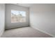 Bedroom features plush carpeting, neutral paint, and a window allowing for natural light at 132 Fideaux Blvd # 254, Raleigh, NC 27603