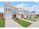 Attractive townhomes feature individual garages, well-kept lawns, and pleasing neutral color schemes at 132 Fideaux Blvd # 254, Raleigh, NC 27603